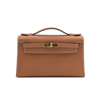 HERMES Kelly Pochette in Gold Swift leather